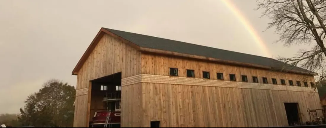 The Saltworks Marine storage barn under a rainbow